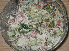 Fresh cabbage salad with ham and peas